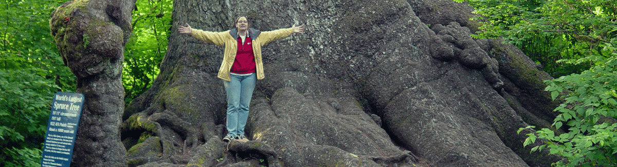 Cheryl standing in front of the world