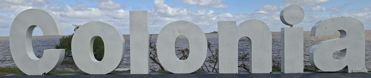 The city name sign is about halfway between Playa urbana Balneario Municipal and Playa urbana Real de San Carlos, about a 45 minute walk from downtown.