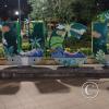 Sucua city name sign in Parque Central at Carlos Olson and Domingo Comin