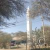 A tower inside a closed area behind Primax gas station