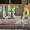 City name sign in from of the police station at the Plaza de Armas