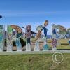 City name sign at the beach